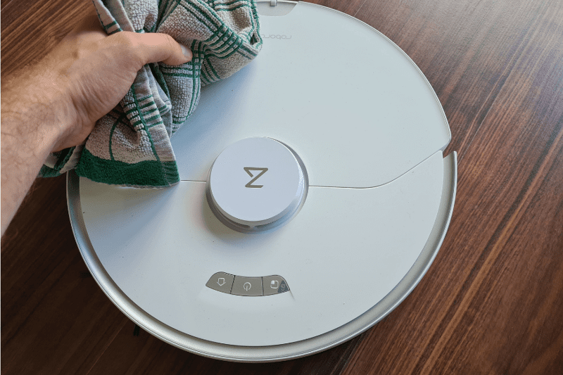 Wiping the Roborock S7 Pro with a towel.